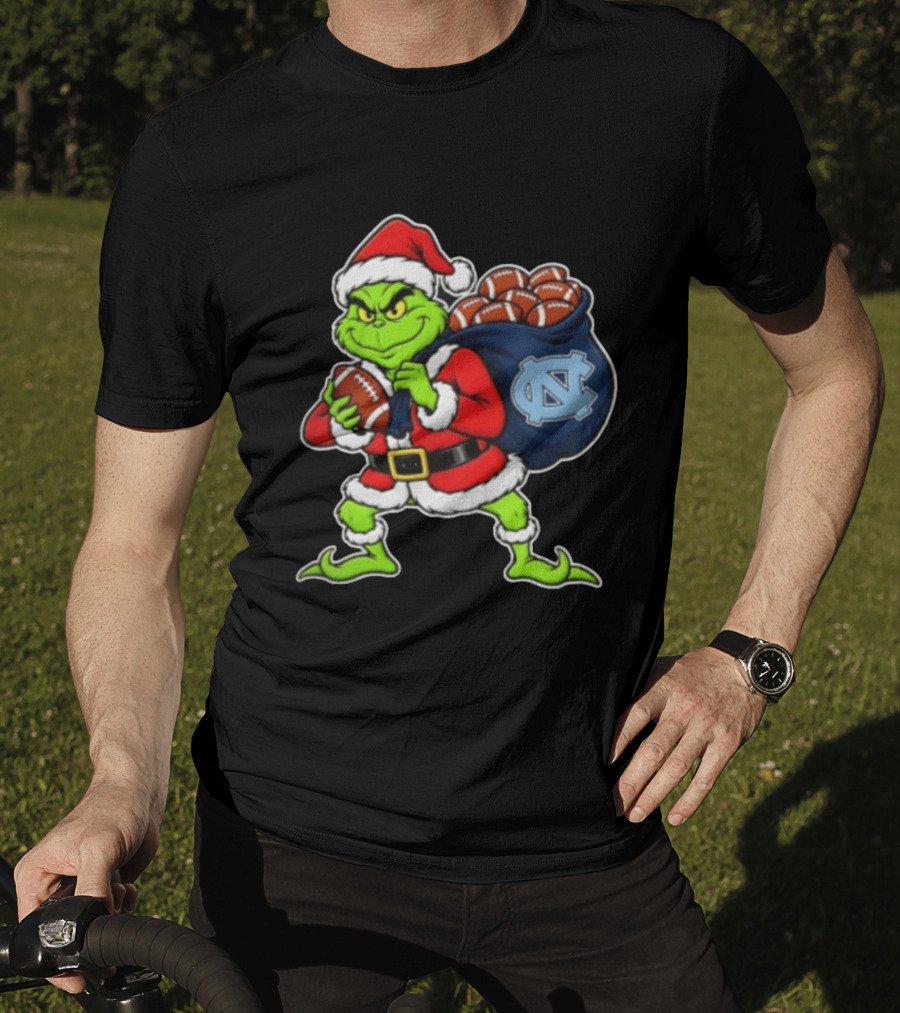 Grinch Santa North Carolina Tar Heels Holding Chiefs Footballs Christmas T-Shirt