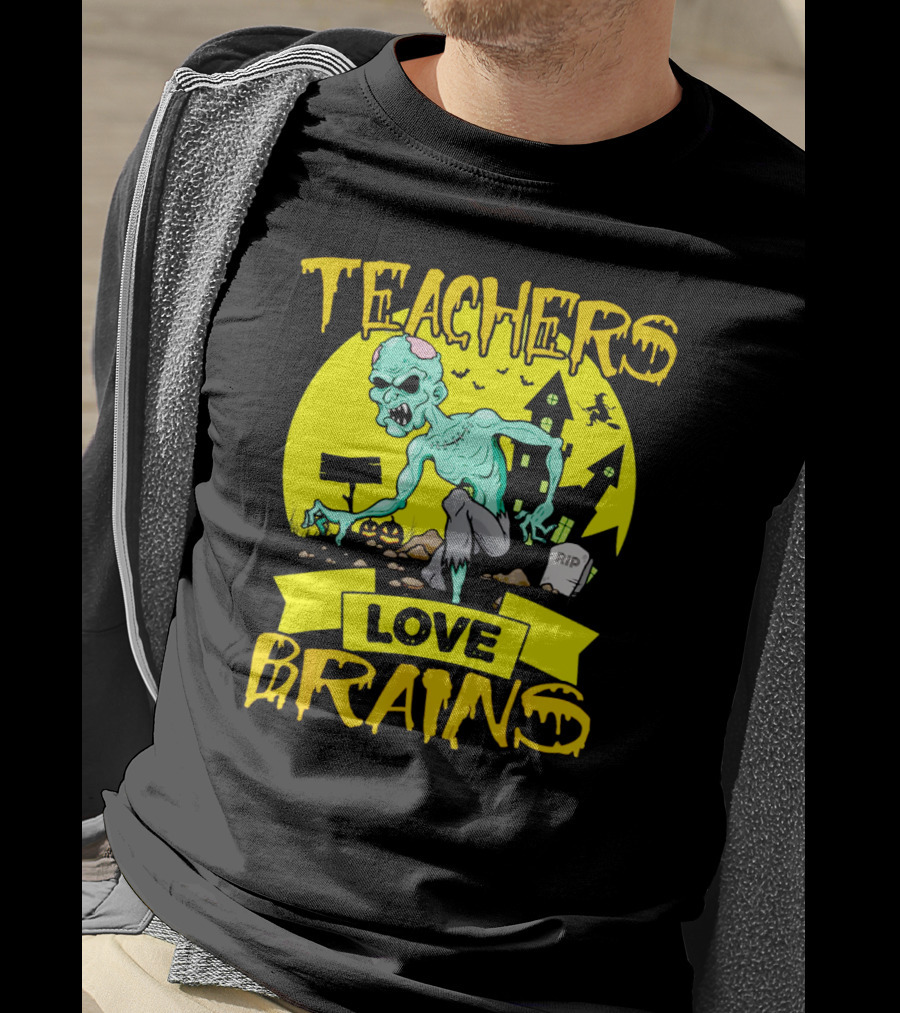 Teachers Love Brains Zombie Halloween Theme With Haunted Houses And Graveyard Background T-Shirt