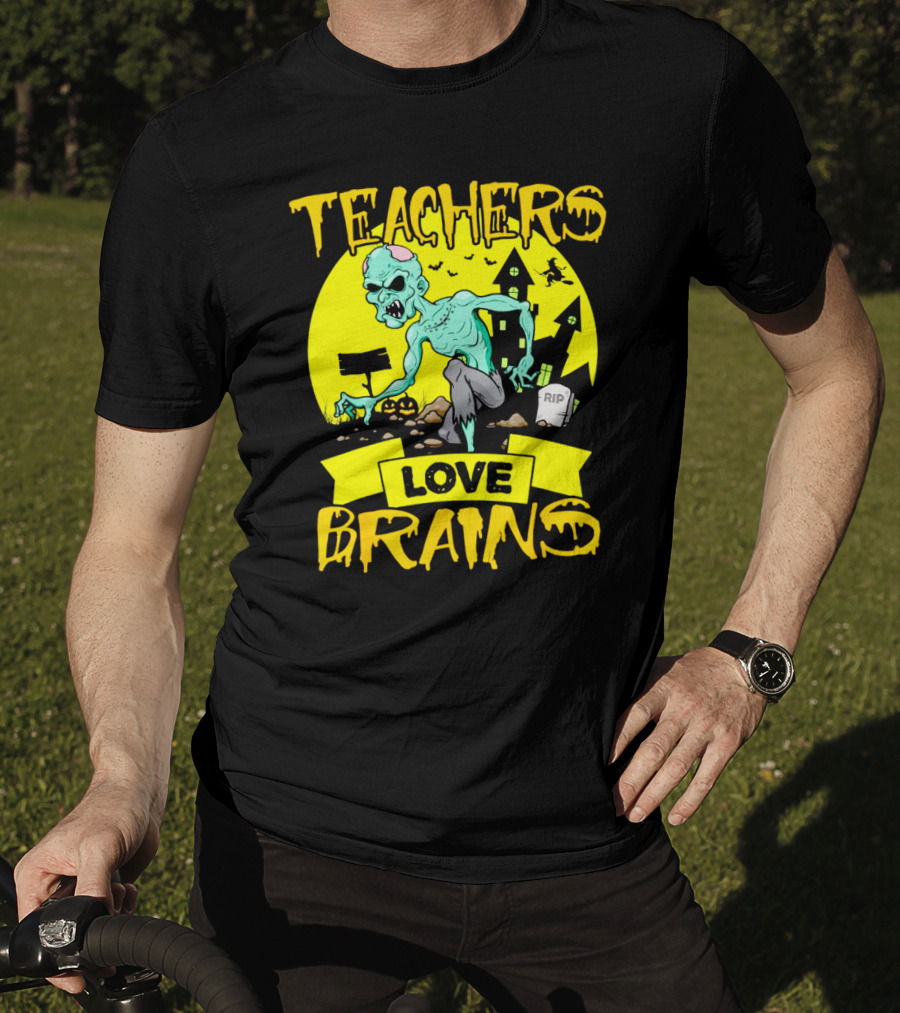 Teachers Love Brains Zombie Halloween Theme With Haunted Houses And Graveyard Background T-Shirt