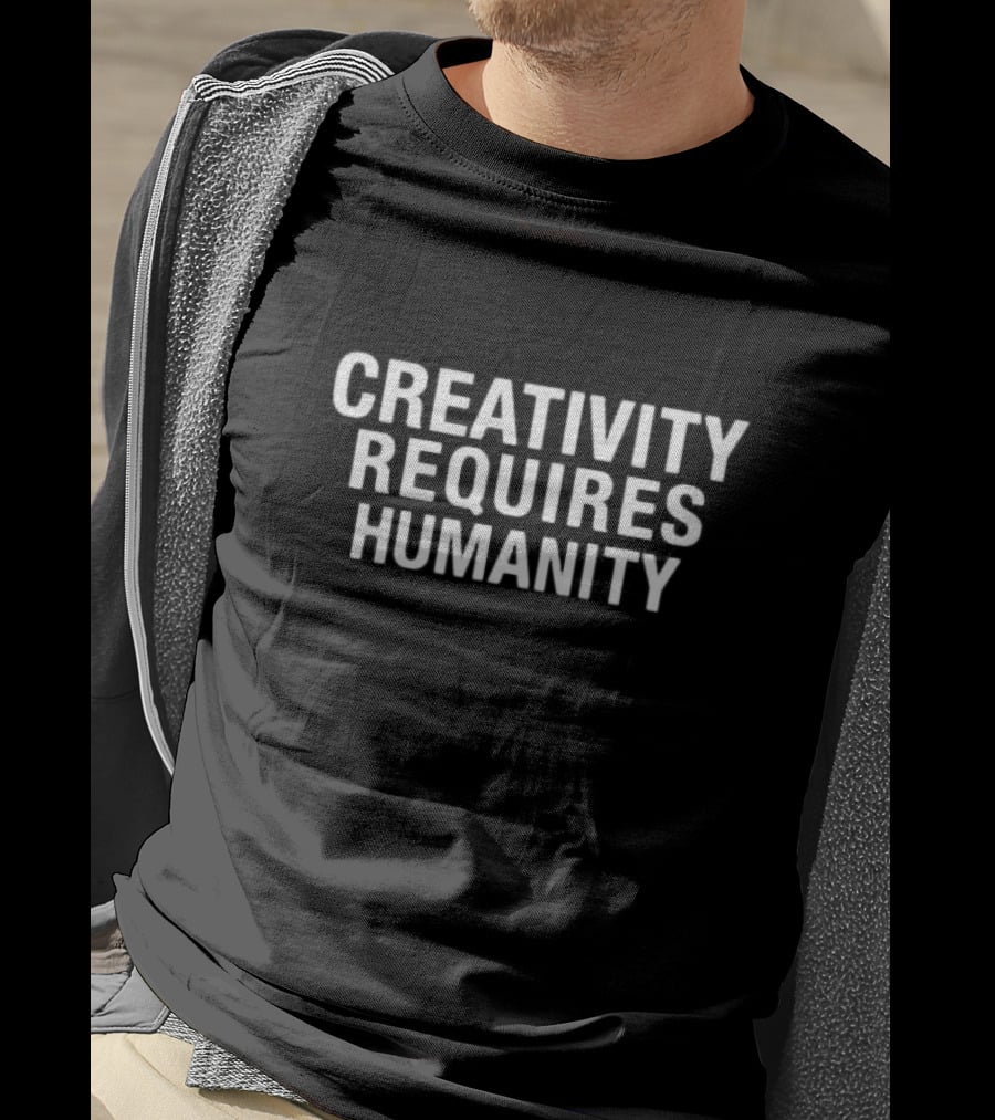 CREATIVITY REQUIRES HUMANITY Textual Emphasis In Bold White Letters T-Shirt