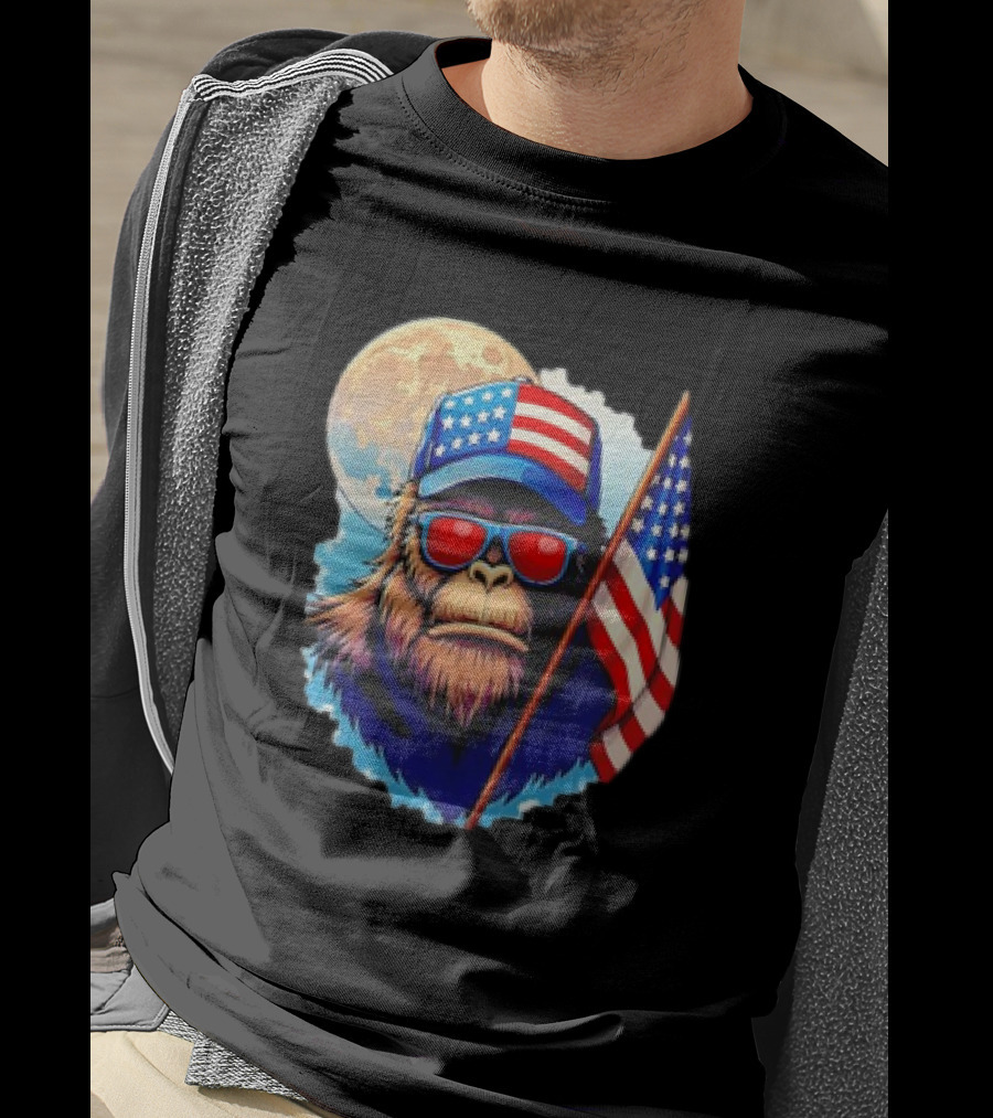 Bigfoot USA Flag Hat Sunglasses Patriotic Moon Background T-Shirt