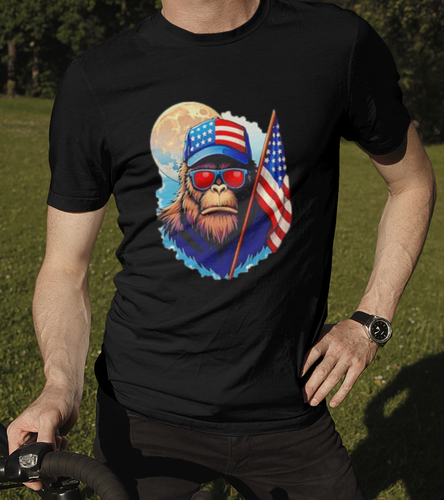 Bigfoot USA Flag Hat Sunglasses Patriotic Moon Background T-Shirt