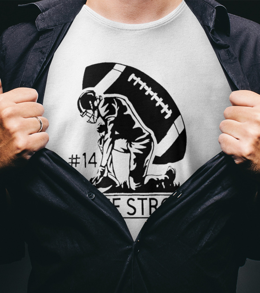 Gage Strong #14 Football Player Kneeling In Front Of Large Football T-Shirt