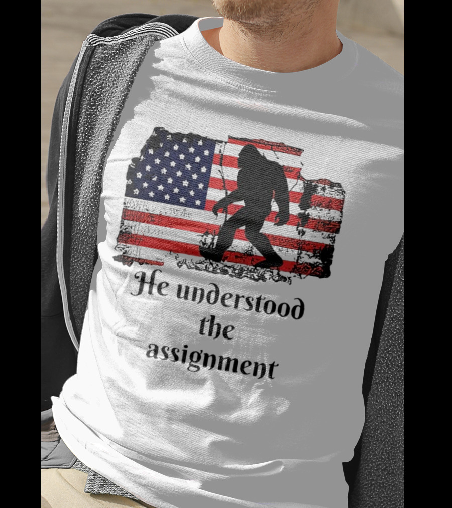 Bigfoot Silhouette With Distressed American Flag He Understood The Assignment T-Shirt