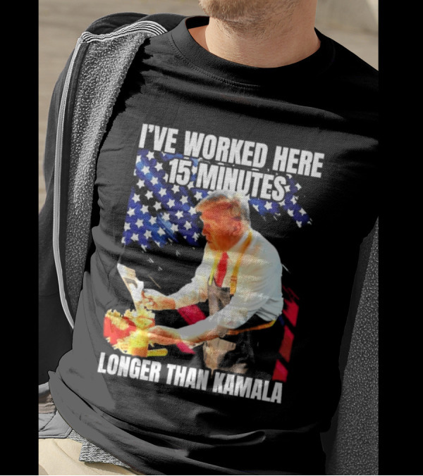 I’ve Worked Here 15 Minutes Longer Than Kamala Donald Trump American Flag Background T-Shirt