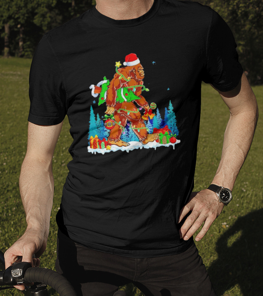 Bigfoot Santa Hugging Christmas Tree With Gifts And Snow Scene T-Shirt