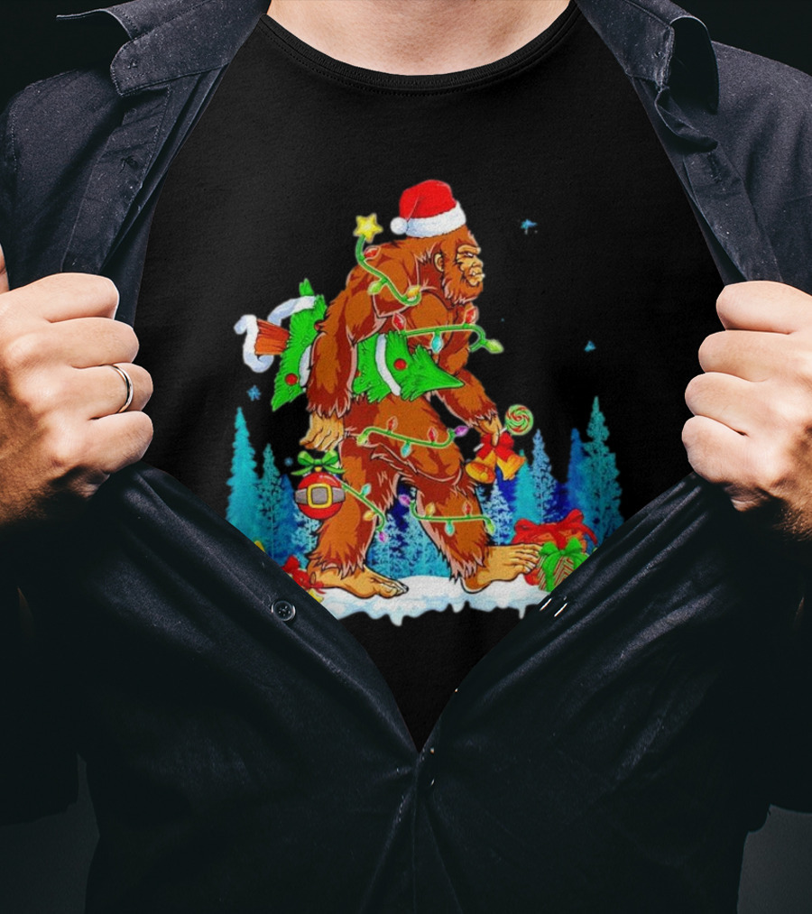 Bigfoot Santa Hugging Christmas Tree With Gifts And Snow Scene T-Shirt