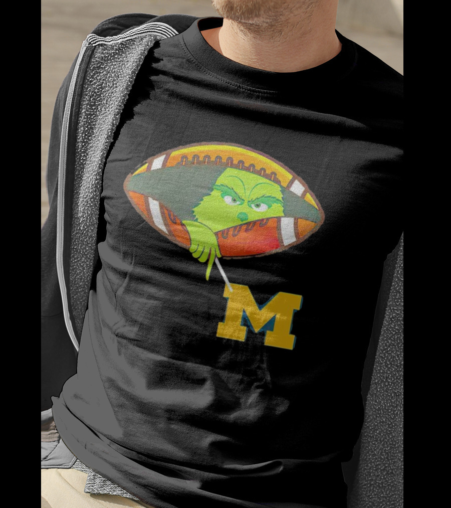 Grinch Peeking From Football Over Michigan Wolverines T-Shirt