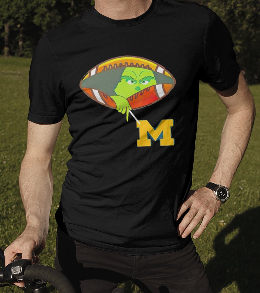 Grinch Peeking From Football Over Michigan Wolverines T-Shirt