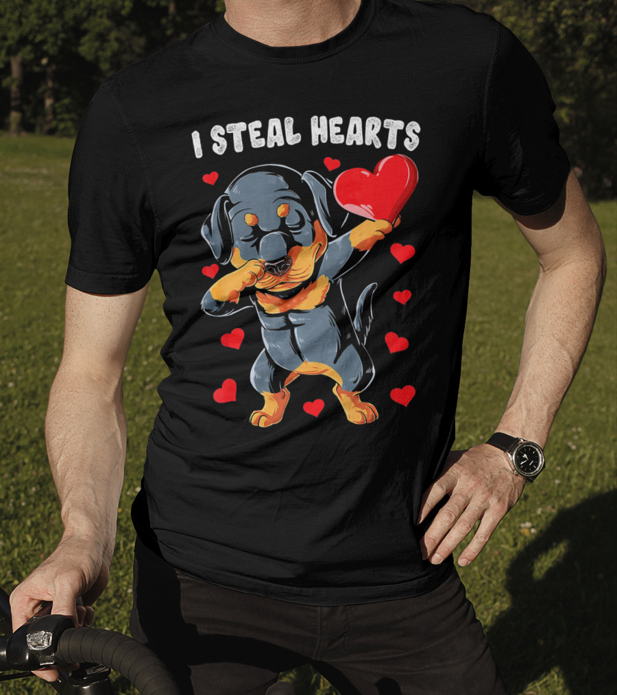 Dabbing Rottweiler Holding Heart Surrounded By I Steal Hearts Text T-Shirt