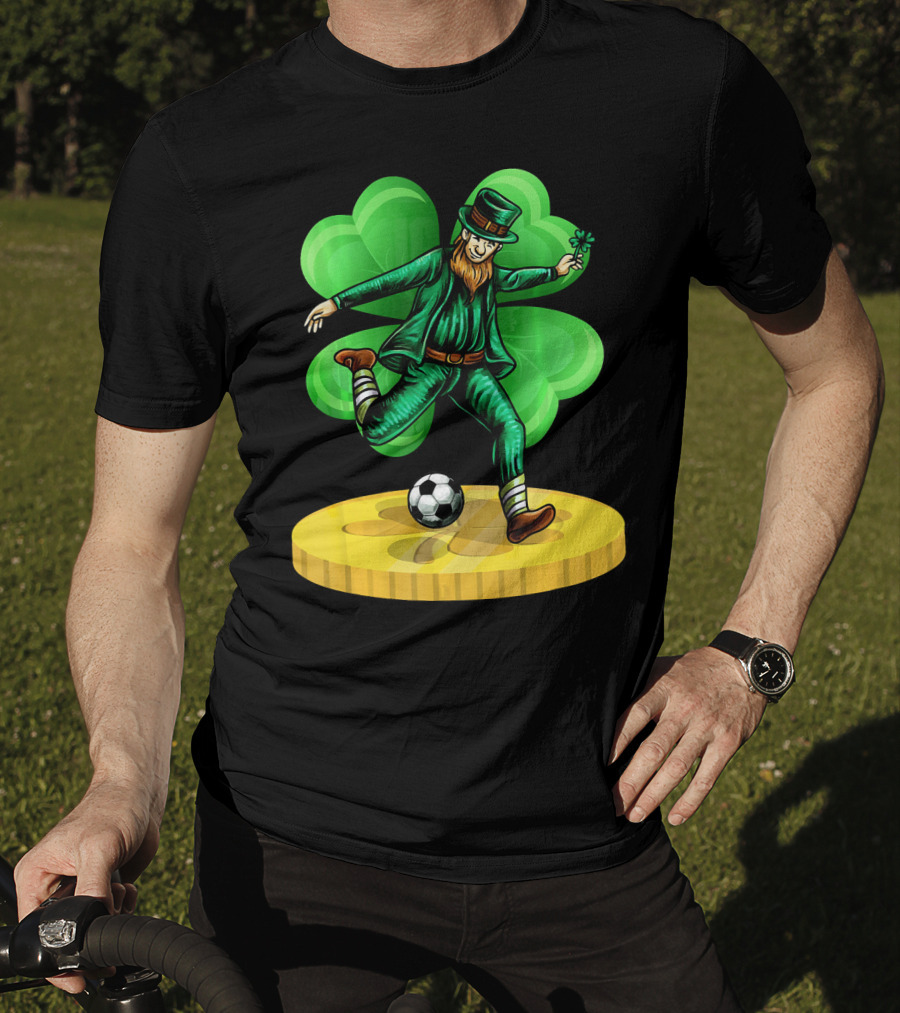 Leprechaun Kicking Soccer Ball On Gold Coin With Shamrock Background T-Shirt