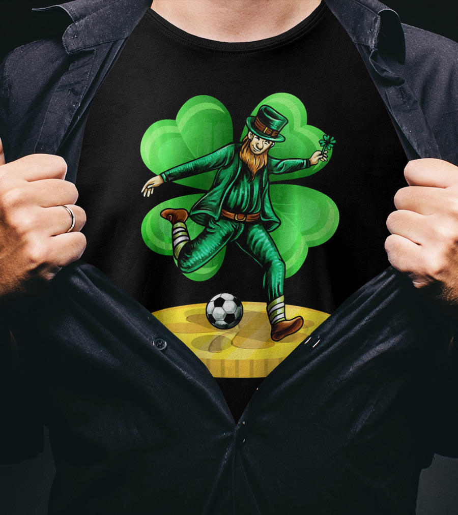 Leprechaun Kicking Soccer Ball On Gold Coin With Shamrock Background T-Shirt