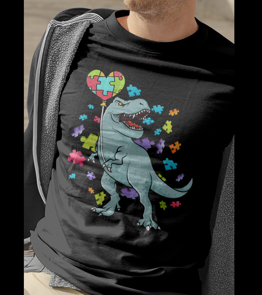 Autism Awareness Dinosaur With Puzzle Heart Balloon And Colorful Puzzle Pieces T-Shirt