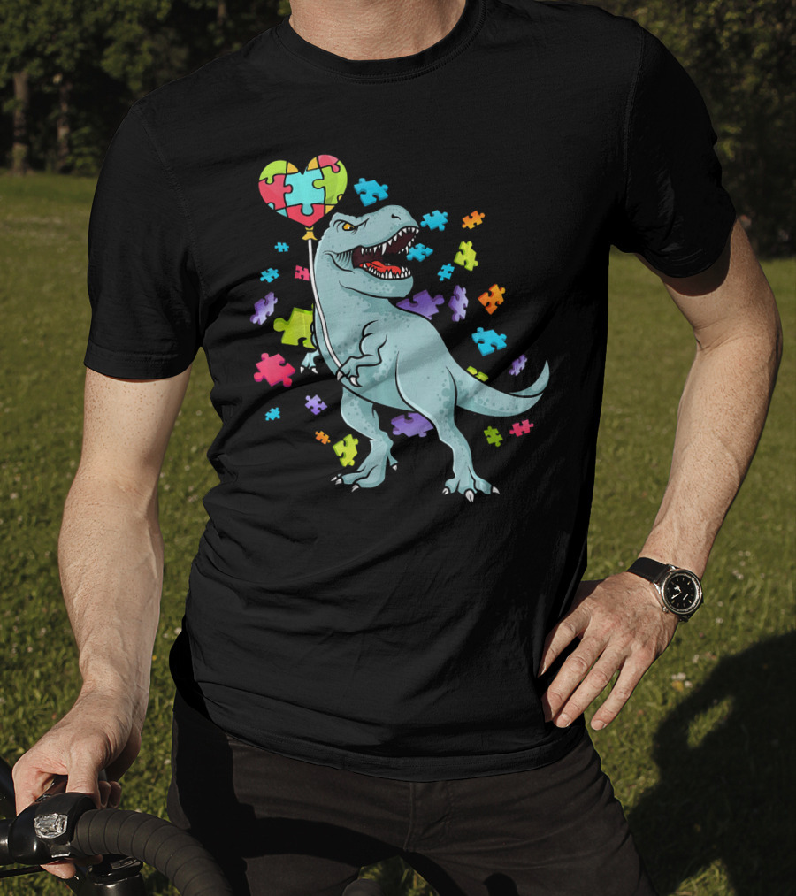 Autism Awareness Dinosaur With Puzzle Heart Balloon And Colorful Puzzle Pieces T-Shirt