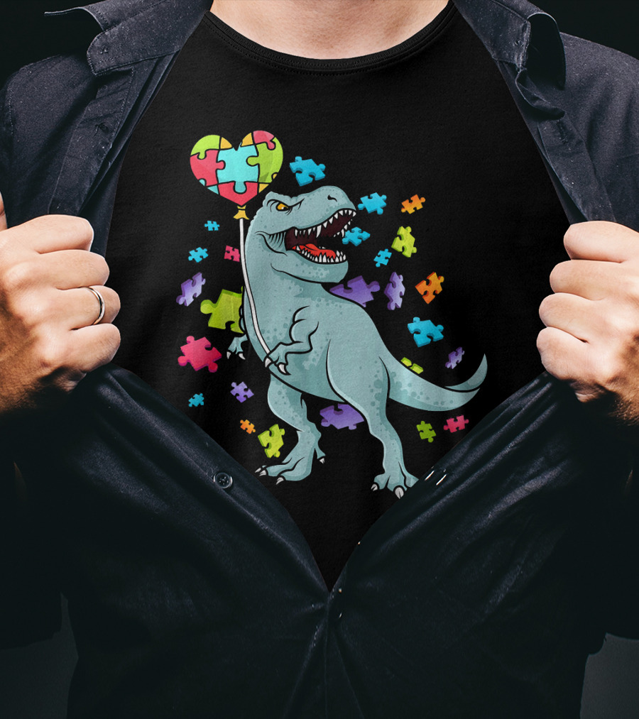 Autism Awareness Dinosaur With Puzzle Heart Balloon And Colorful Puzzle Pieces T-Shirt