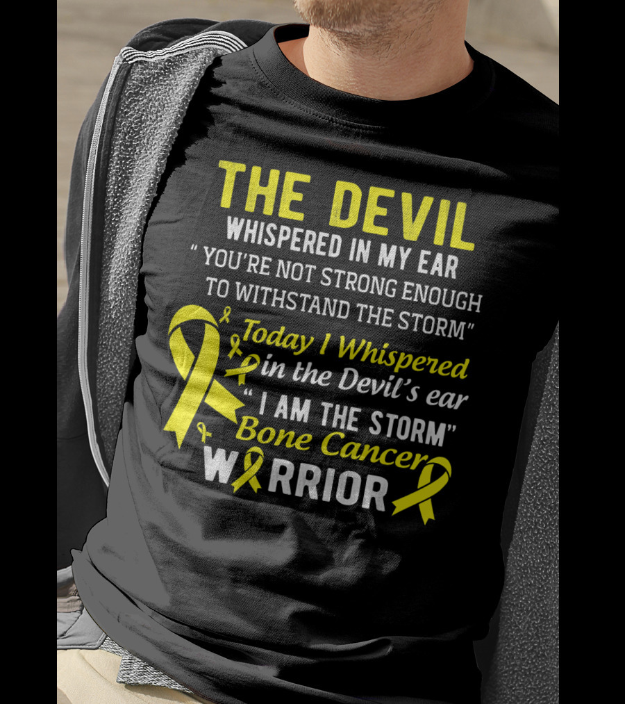 The Devil Whispered You’re Not Strong Enough To Withstand The Storm I Am The Storm Bone Cancer Warrior Yellow T-Shirt