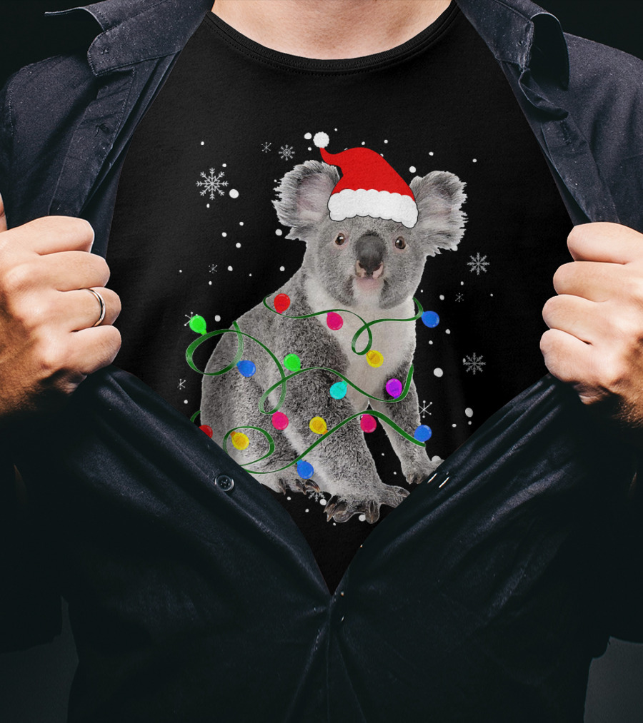 Koala Wrapped In Christmas Lights Wearing Santa Hat With Snowflakes Matching Fam T-Shirt