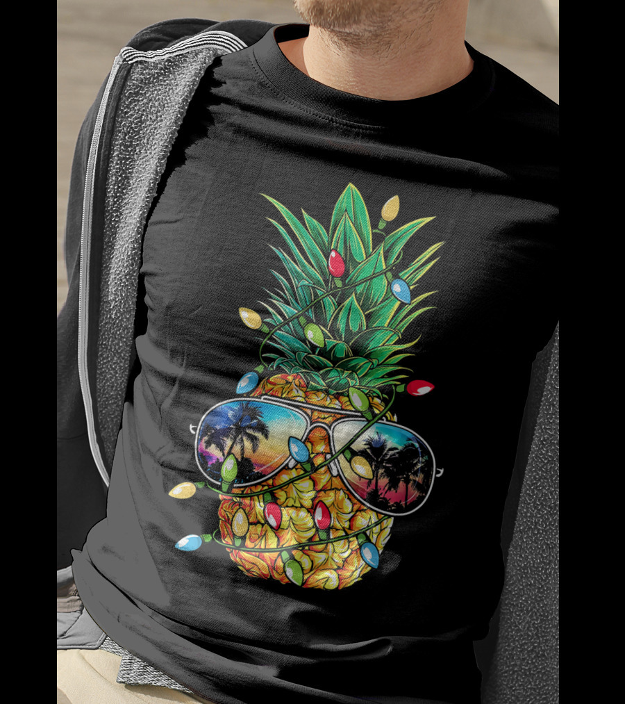 Pineapple Wrapped In Christmas Lights With Sunglasses Reflected Sunset And Palm Trees T-Shirt