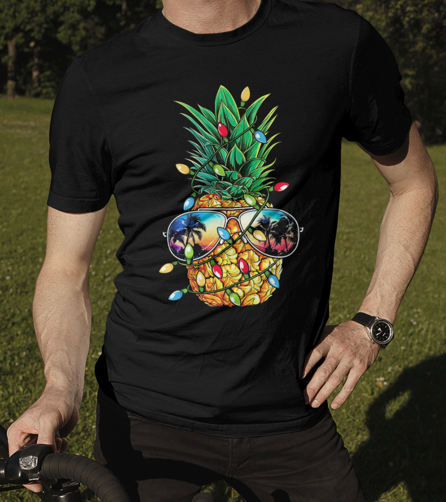 Pineapple Wrapped In Christmas Lights With Sunglasses Reflected Sunset And Palm Trees T-Shirt