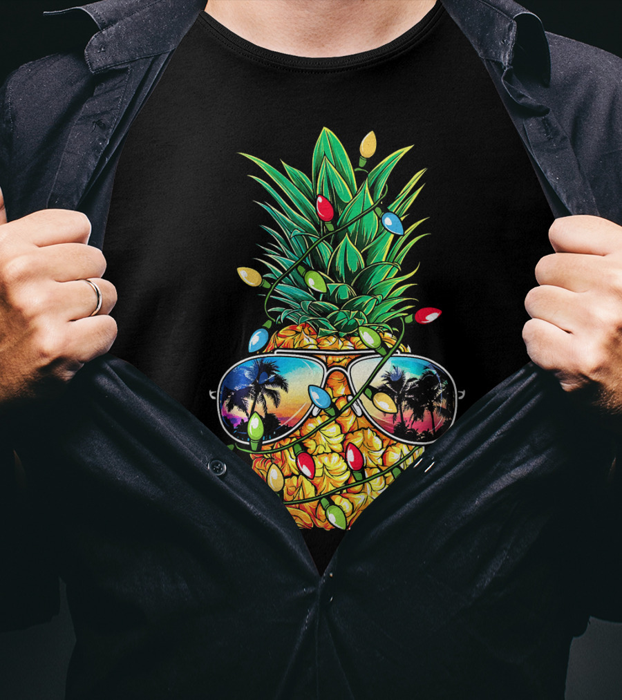 Pineapple Wrapped In Christmas Lights With Sunglasses Reflected Sunset And Palm Trees T-Shirt