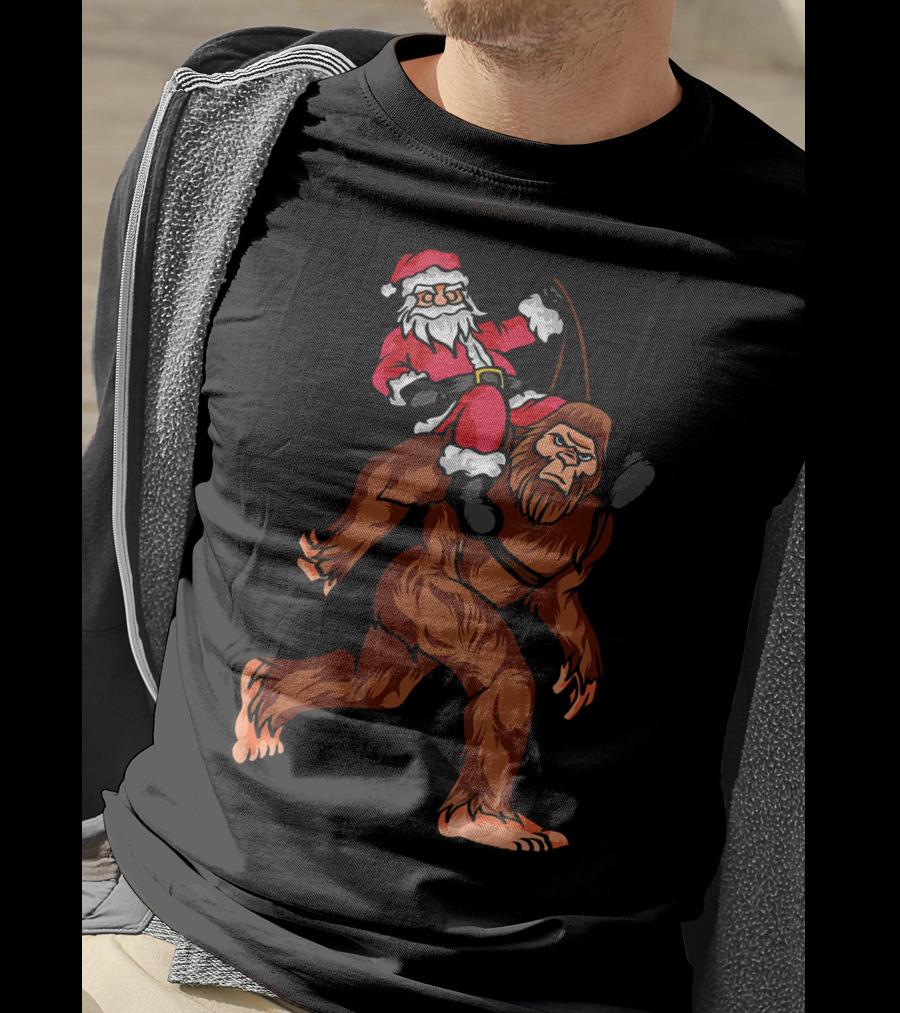 Bigfoot Carrying Santa Claus In Christmas T-Shirt