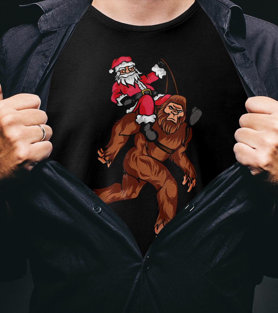 Bigfoot Carrying Santa Claus In Christmas T-Shirt