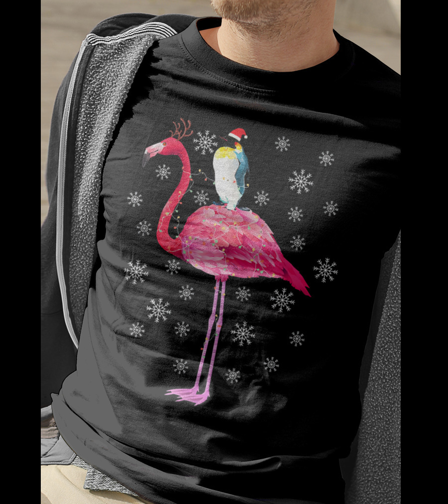 Penguin With Santa Hat Riding Flamingo With Antlers Surrounded By Snowflakes T-Shirt