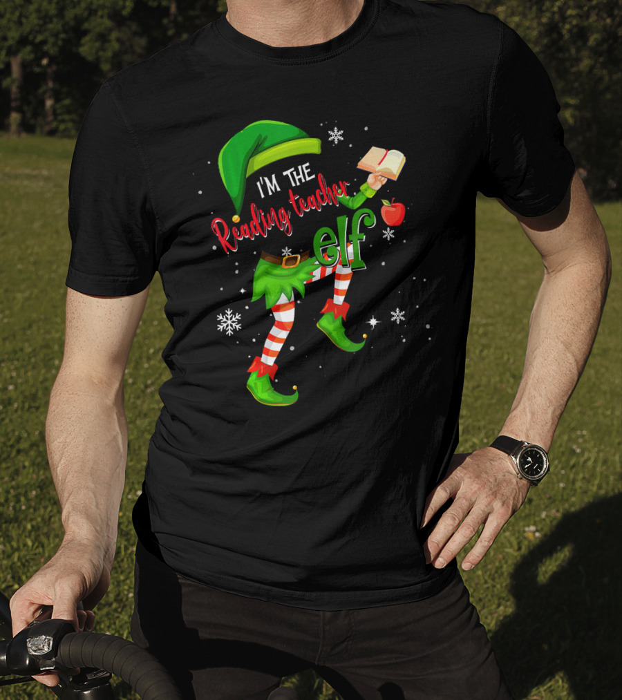 I'm The Reading Teacher Elf Holding Book Apple Wearing Elf Outfit Snowflakes T-Shirt