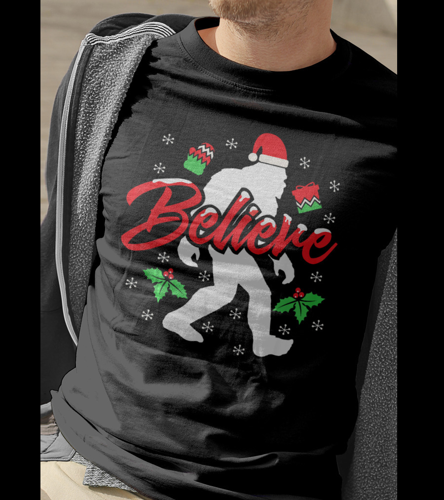 Believe Bigfoot Christmas Santa Hat Snowflakes Holly T-Shirt