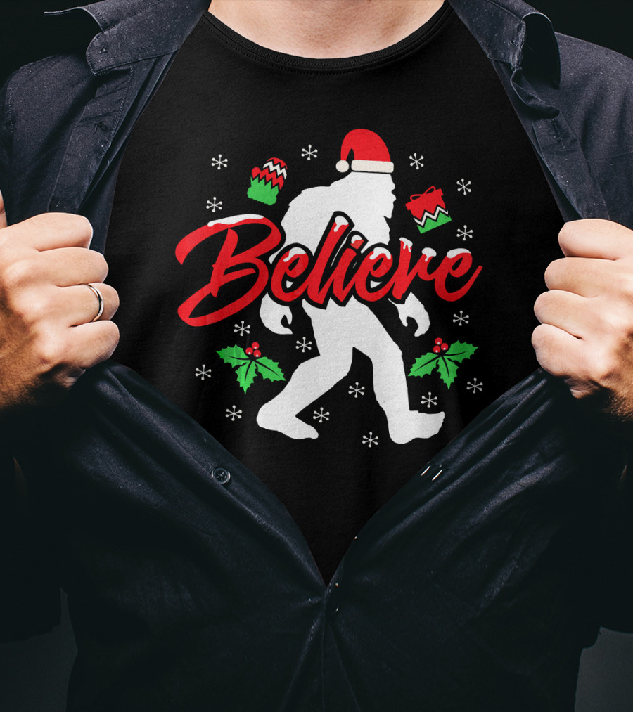 Believe Bigfoot Christmas Santa Hat Snowflakes Holly T-Shirt