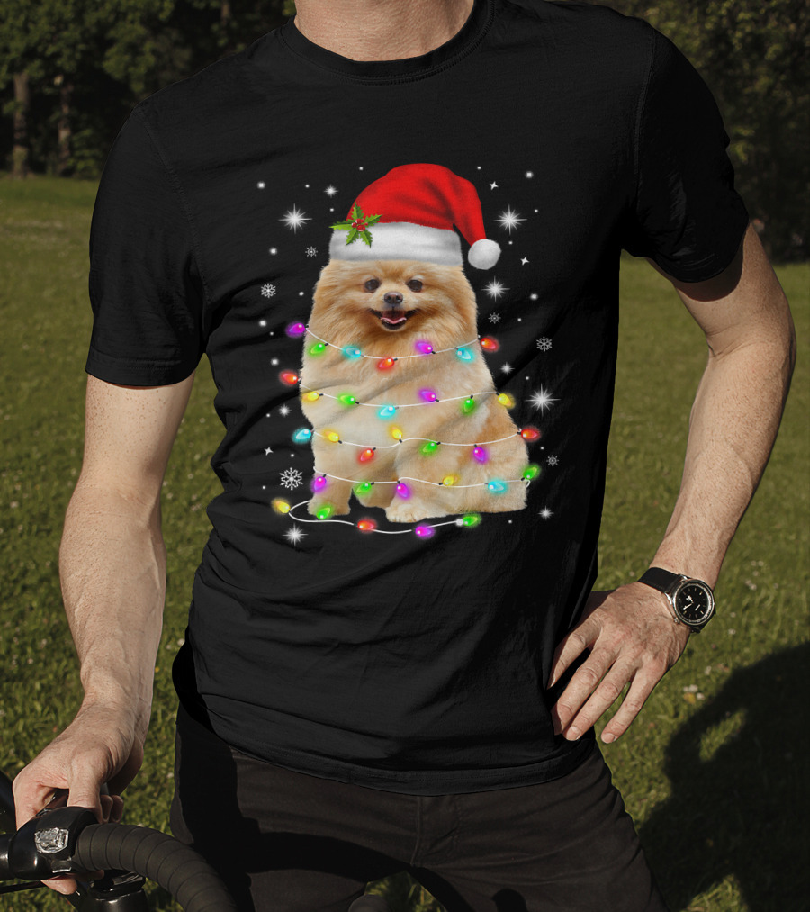 Pomeranian Pup Wrapped In Christmas Lights With Santa Hat And Festive Glow T-Shirt